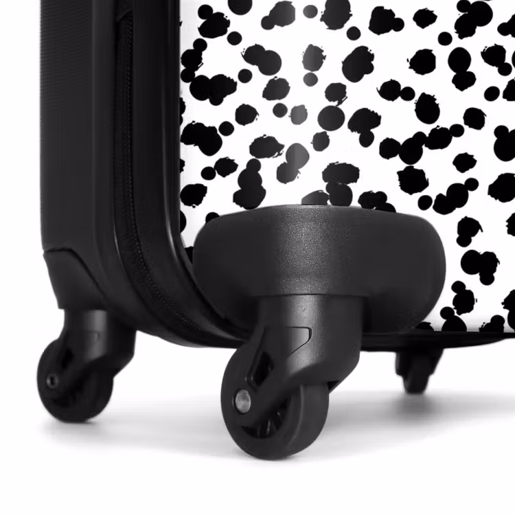 Valise - Points noirs en forme de brosse sur fond blanc. — 7