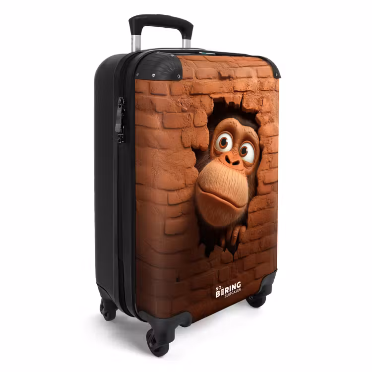 Valise - Un singe aux grands yeux regarde à travers un trou dans un mur de briques — 2